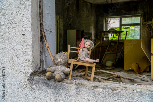 Horror-film like doll and teddy bear in an abandoned kindergarten in Pripyat, Ukraine inside the Chernobyl Exclusion Zone