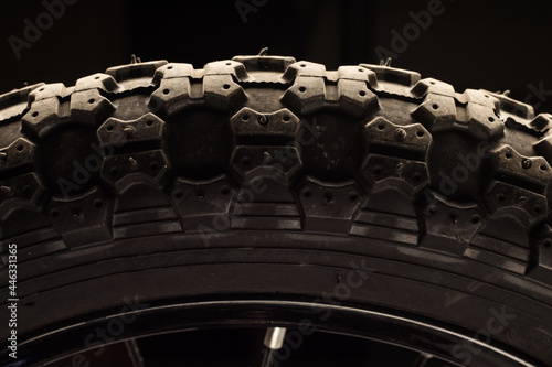 Part of a bicycle tire on a black background