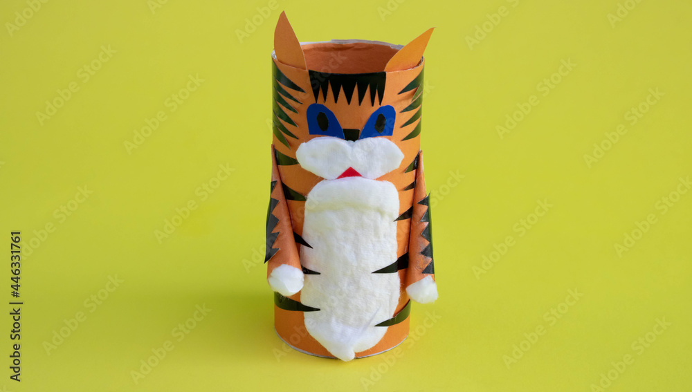 DIY a tiger from a toilet paper sleeve for the Chinese new year. Create paper crafts for children