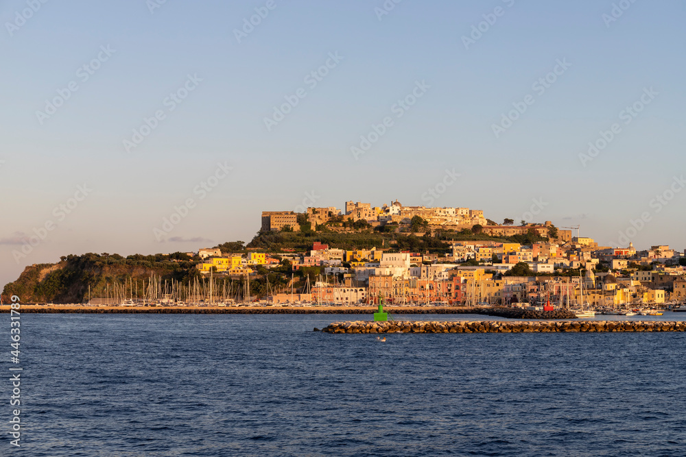 Procida island at sunset seen from the sea, Gulf of Naples, Italy