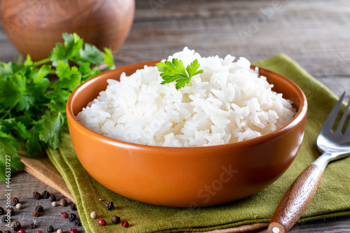 White rice in bowl on table photo
