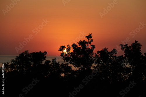 Landscape of sunset sky above Lviv city on beautiful summer day. Clody warm sky at sunset. Panorama of city from mountain, High castle.