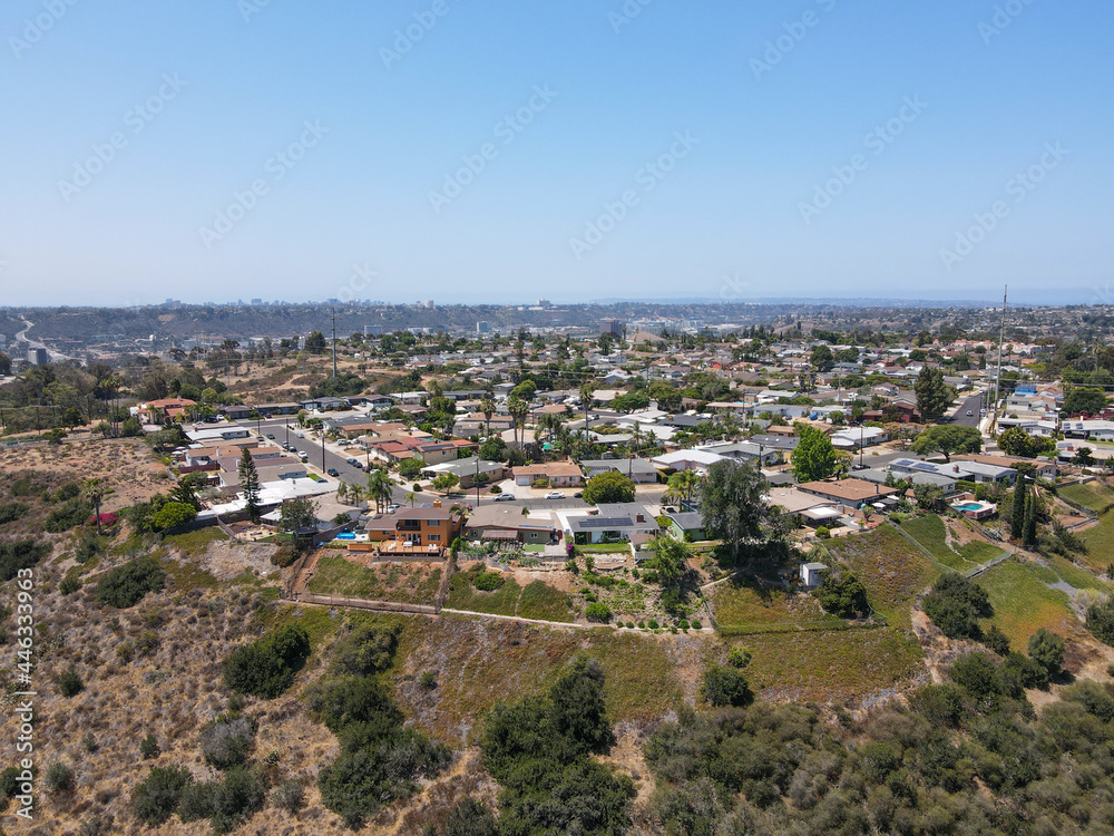 Aerial view of villas on the top of a valley and cliff with blue sky in San Diego County, California, USA