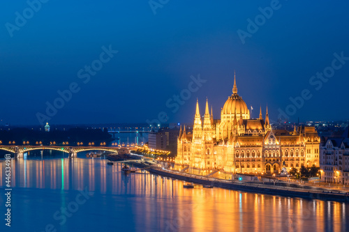 Side view of the Hungarian Parliament building illuminated in Budapest, during blue hour