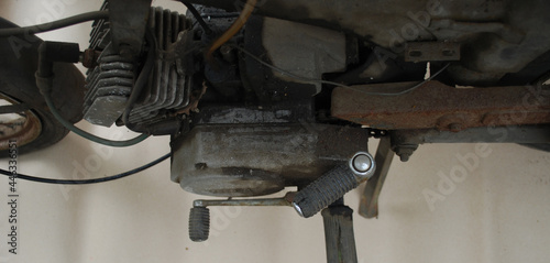 View from above on engine and gearbox of old rusty and retro motorcycle.
