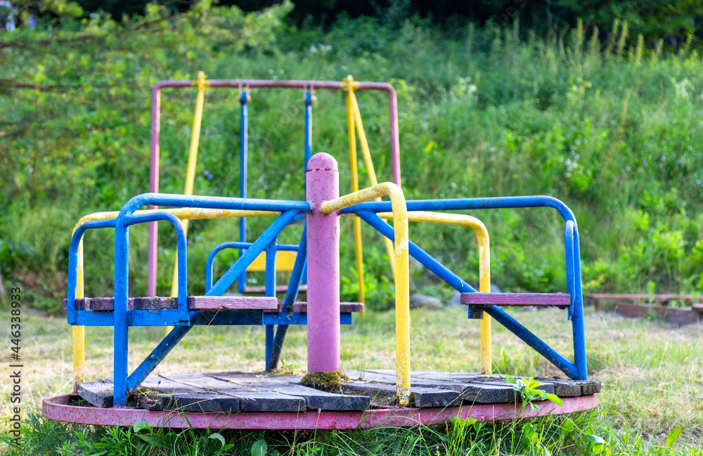 Abandoned playground. rusty non-working carousel. Children's games. Abandoned playground. rusty non-working carousel. Children's games.