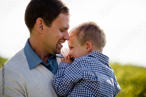 Close Up of Dad & Son in Wildflower Field photo