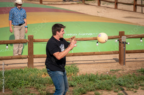 Man playing tetherball photo