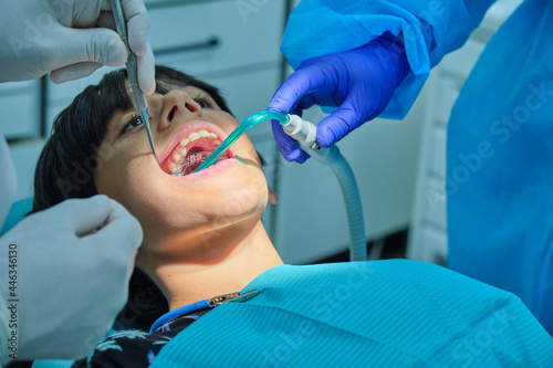 Caucasian child at dentist with open mouth