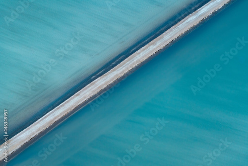 Fotografie, Obraz Aerial photography, Useless Loop, Shark Bay, Western Australia, June 2021, abstract images of salt ponds from above in varying colors of blue, green, and brown hues