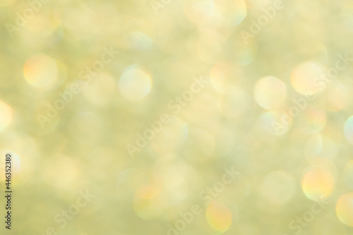 bright glitter background: bokeh effect from many colored lights on frozen glass, toning © BUSLIQ