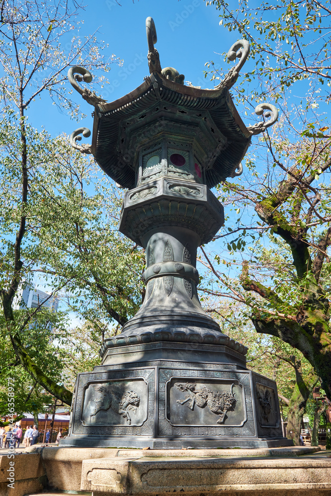 Fototapeta premium The bronze lantern in the garden of Yasukuni Shrine in Chiyoda, Tokyo. Japan