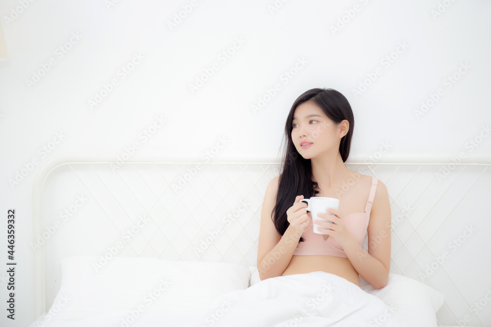 Beautiful young asian sexy woman in underwear drinking coffee in the morning on bed at bedroom, asia girl with seductive figure fit drinking beverage for relax after wake up, lifestyle concept. Beautiful young asian sexy woman in underwear drinking coffee in the morning on bed at bedroom, asia girl with seductive figure fit drinking beverage for relax after wake up, lifestyle concept.