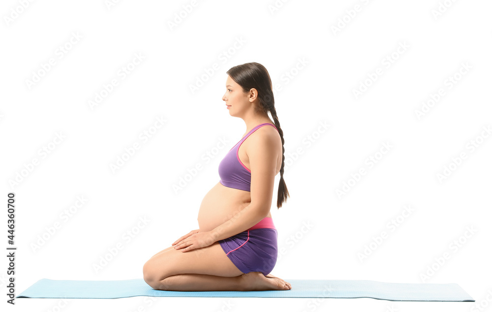 Young pregnant woman practicing yoga on white background Young pregnant woman practicing yoga on white background