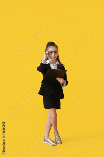 Cute little businesswoman w...
