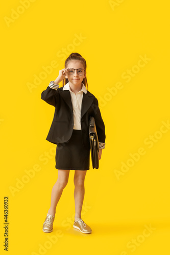 Cute little businesswoman w...