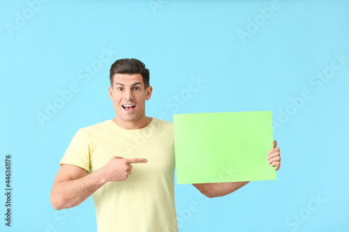 Surprised young man pointin...