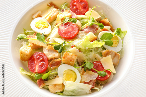 Plate with tasty Caesar salad, closeup