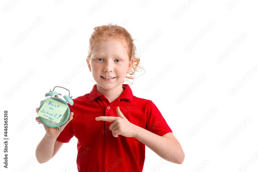 Cute little schoolgirl with alarm clock on white background Cute little schoolgirl with alarm clock on white background