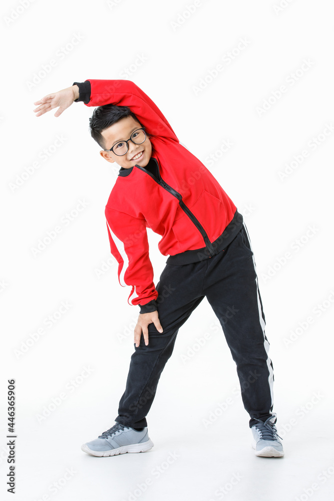 Lovely cutout portrait of strong young Asian boy on red jacket and black pants smile and happy as enjoy exercise of bending down body and stretching leg for warming up before playing sport Lovely cutout portrait of strong young Asian boy on red jacket and black pants smile and happy as enjoy exercise of bending down body and stretching leg for warming up before playing sport