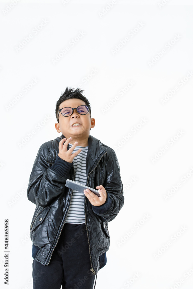 Funny cutout portrait of pity Asian boy wearing glasses and black jacket frown and tense his hand as disappointed, sad, and angry at unsatisfied failure of game playing on mobile phone Funny cutout portrait of pity Asian boy wearing glasses and black jacket frown and tense his hand as disappointed, sad, and angry at unsatisfied failure of game playing on mobile phone