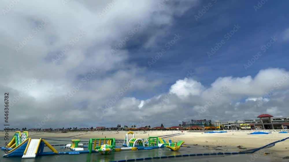 OKINAWA, JAPAN - JUNE 2021 : View of Chura sun beach (Ocean or sea). Clear blue summer sky and clouds. Wide view time lapse shot in daytime. OKINAWA, JAPAN - JUNE 2021 : View of Chura sun beach (Ocean or sea). Clear blue summer sky and clouds. Wide view time lapse shot in daytime.