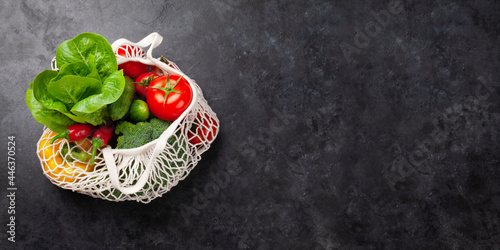 Eco friendly mesh shopping bag with fresh vegetables