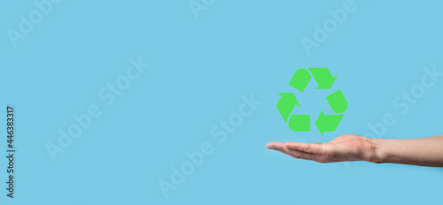 Hand hold recycling icon.Ecology and renewable energy concept.ECO sign, Concept Save green planet. Symbol of environmental protection.Recycling waste.Symbol of earth day, concept of nature protection © Ivan