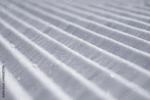 Fototapeta Naklejka Na Ścianę i Meble -  Close-up groomed snow at ski resort, Velvet snow