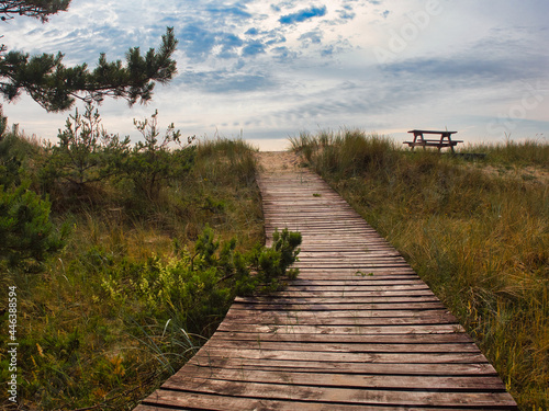 Exit through the dune to the Baltic Sea. A table with benches on the dune.