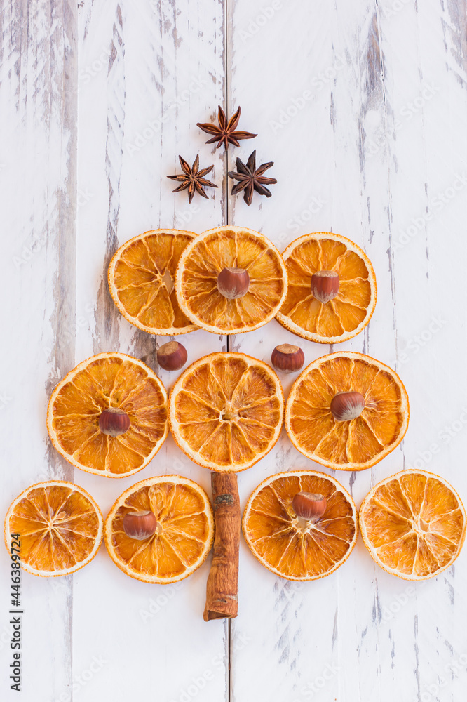 Christmas tree made of dried oranges, cinnamon and anise. Viewed from above. Christmas tree made of dried oranges, cinnamon and anise. Viewed from above.