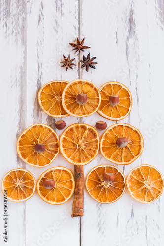Christmas tree made of dried oranges, cinnamon and anise. Viewed from above.