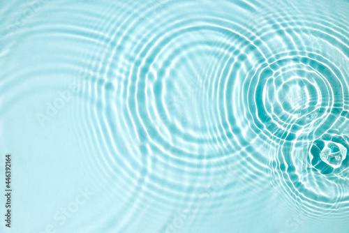 Blue water texture, blue mint water surface with rings and ripples. Spa concept background. Flat lay, copy space. photo