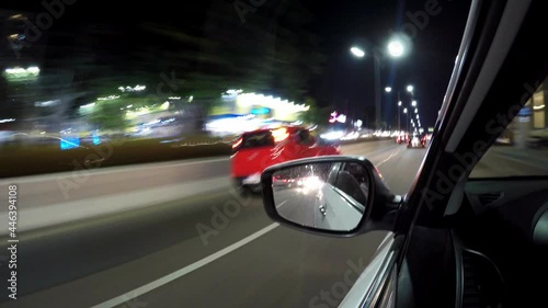 Time lapse POV of detail of drive car on avenue and street of Sao Paulo city at night photo