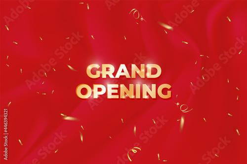 grand opening banner with confetti on red background.