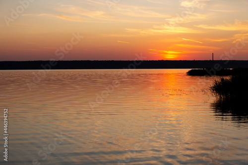 beautiful sunset over the lake in summer © Natalya Ugryumova