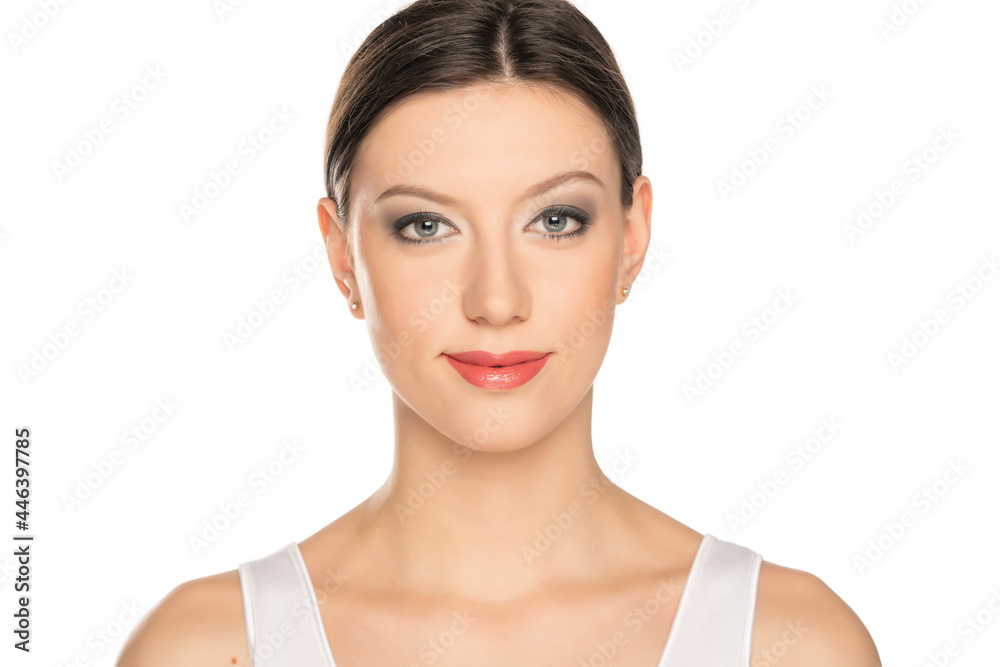 portrait of a young beautiful woman with blue eyes and makeup