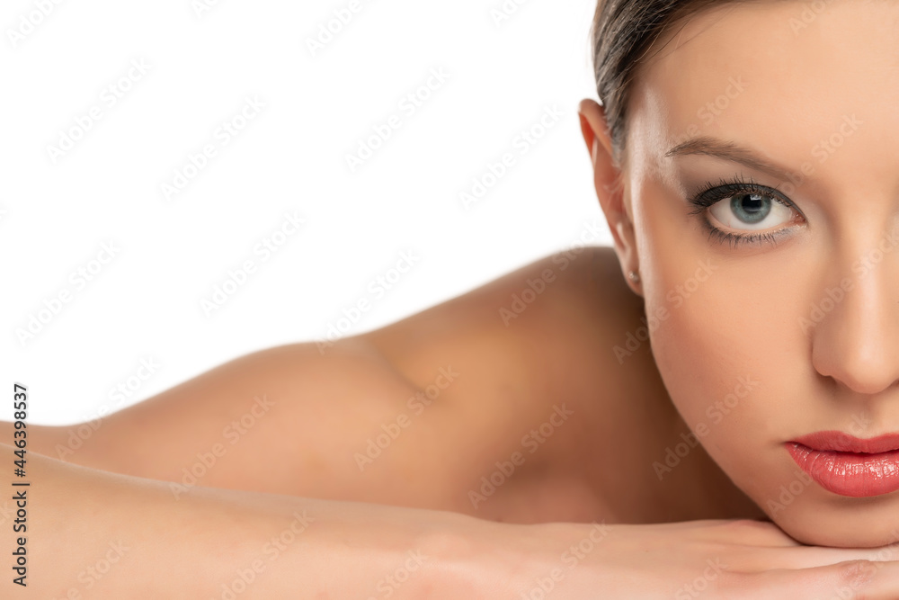Half portrait of a young lying woman with blue eyes Half portrait of a young lying woman with blue eyes