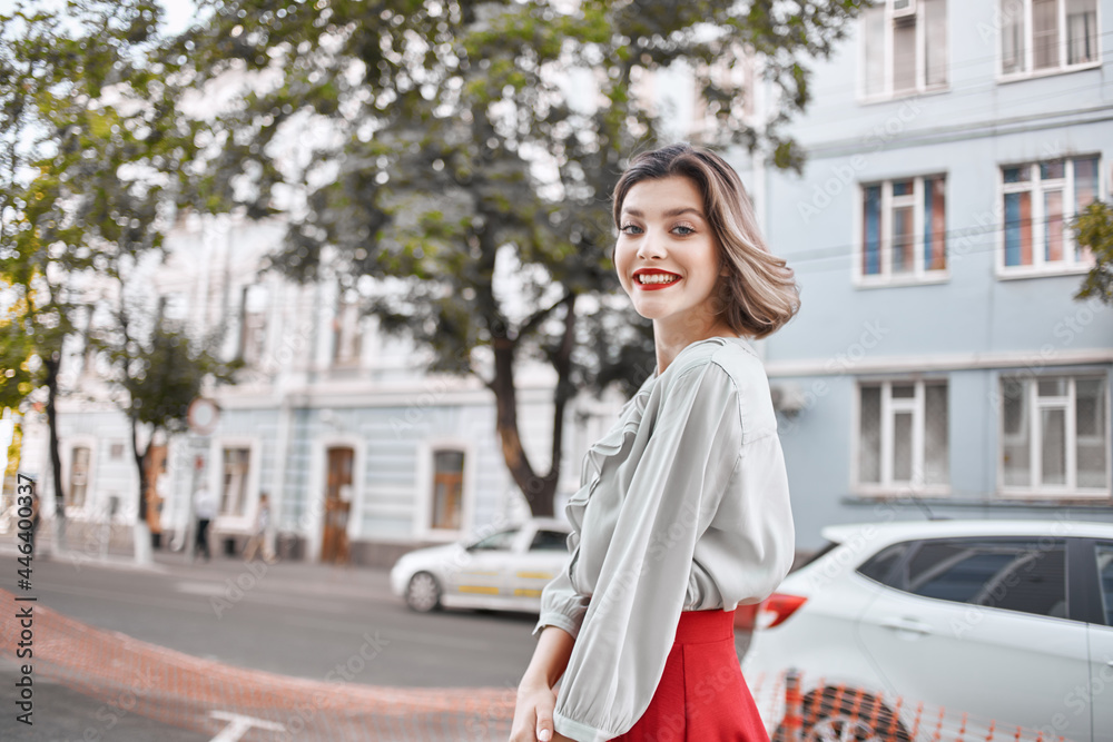 Obraz premium cute blonde girl with red lips outdoors walk lifestyle