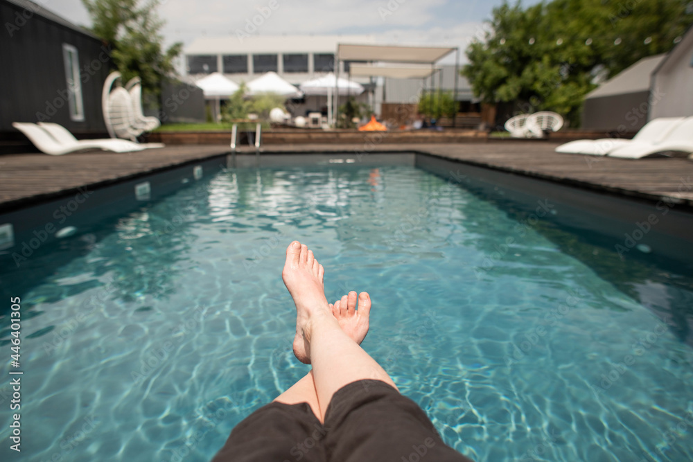 photo of legs by the pool