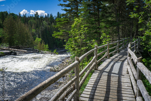 Boardwalk leading to the point of view on the Grand Sault waterfall in the Canyon des Portes de l'Enfer nature park in Bas Saint Laurent (Quebec, Canada)