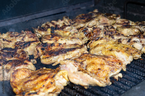 Superior chicken legs cooking on a hot grill. frying meat on a hot barbecue grill.