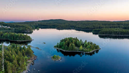 Evening panorama on Karelian lake Kovdozero. Settlement Zelenoborsky, Kandalaksha, Murmansk region, Kola Peninsula. Polar day. Karelian landscape