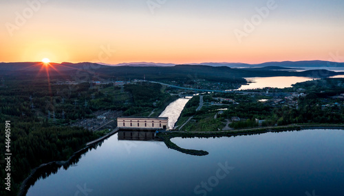 Evening panorama with Knyazhegubskaya Hydroelectric power station and dam on lake Kovdozero. Settlement Zelenoborsky, Kandalaksha, Murmansk region, Kola Peninsula. Polar day. Karelian landscape photo