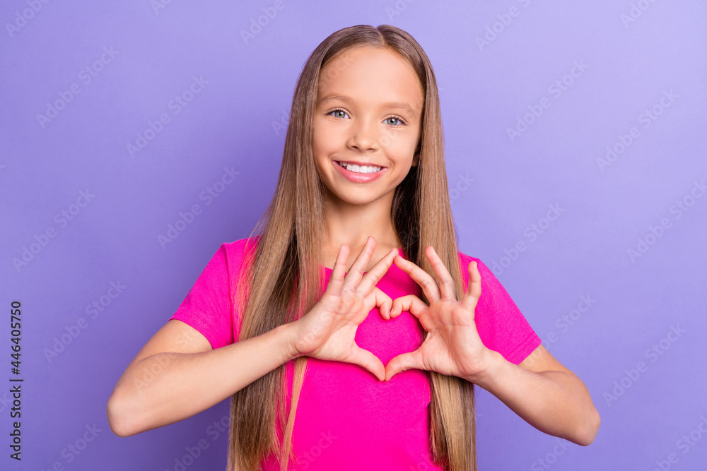 Photo of charming young happy positive girl make fingers heart shape smile isolated on violet color background Photo of charming young happy positive girl make fingers heart shape smile isolated on violet color background