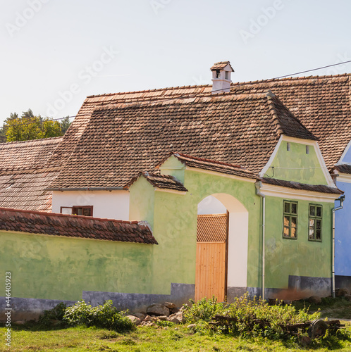 Painted traditional old houses in medieval Saxon village of Viscri, Romania photo