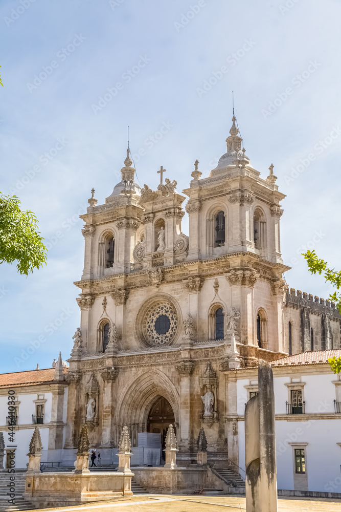 View at the facade of the Alcobaça Monastery (Mosteiro de Santa Maria de Alcobaça), a Catholic monastic complex, the church are Gothic, the towers are Baroque