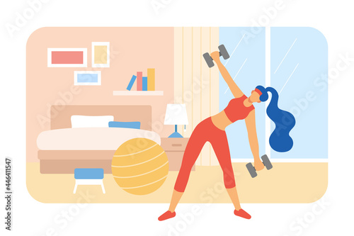 Woman strength training in bedroom