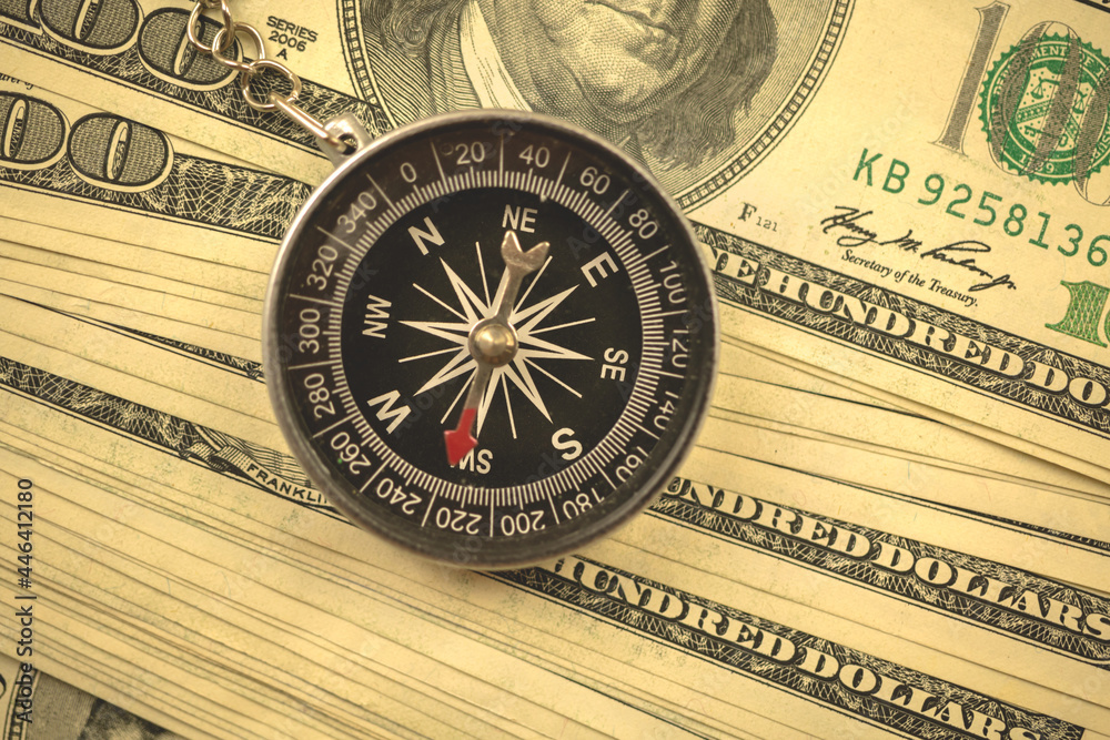 Guessing the dollar rate concept, US currency and compass, busienss background photo Guessing the dollar rate concept, US currency and compass, busienss background photo