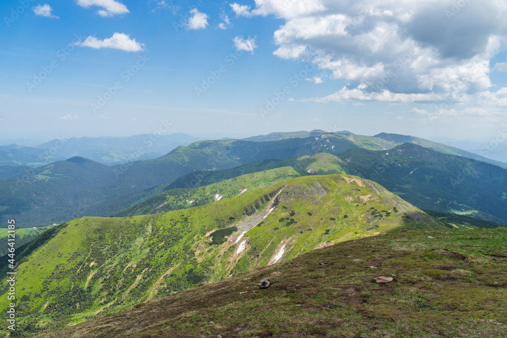 A beautiful view from Hoverla in the Carpathians to the mountains against the background of the sky. Ukraine.
